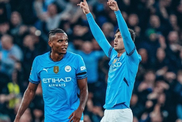 Manuel Akanji dan John Stones