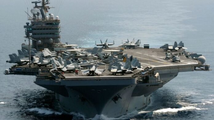 Kapal induk USS Abraham Lincoln dan beberapa kapal perusak berpeluru kendali akan tiba di Timur Tengah._HOLOPIS